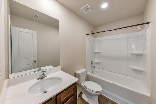 513 Moline Way, Locust Grove, GA 30248 - bathroom with toilet, vanity, washtub / shower combination, and wood finished floors