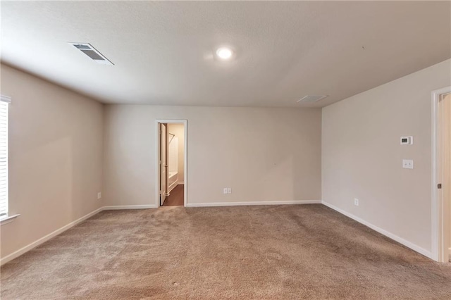 513 Moline Way, Locust Grove, GA 30248 - spare room featuring light carpet, baseboards, and recessed lighting