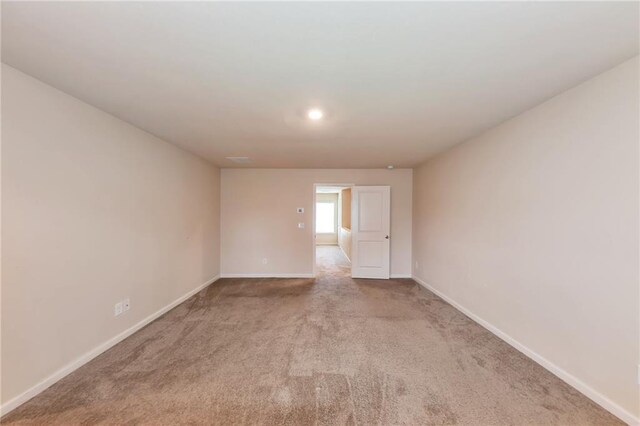 513 Moline Way, Locust Grove, GA 30248 - spare room featuring light carpet, baseboards, and recessed lighting