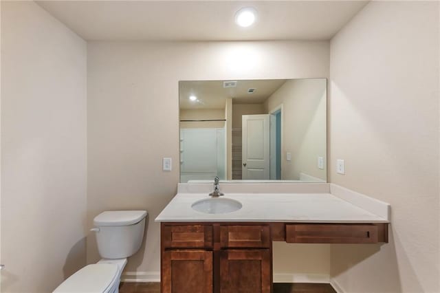 513 Moline Way, Locust Grove, GA 30248 - bathroom with toilet, vanity, and baseboards