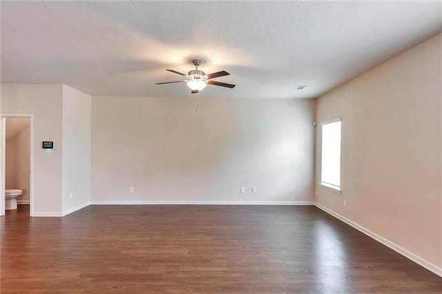 513 Moline Way, Locust Grove, GA 30248 - spare room featuring a ceiling fan, dark wood finished floors, and baseboards