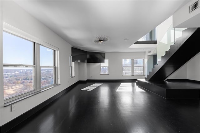 unfurnished living room featuring dark hardwood / wood-style floors