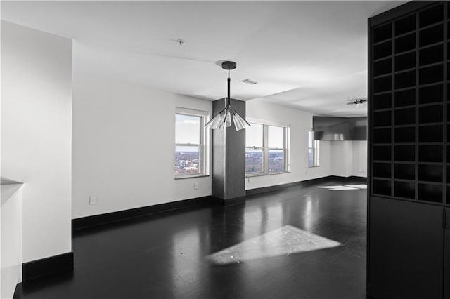 unfurnished dining area featuring plenty of natural light