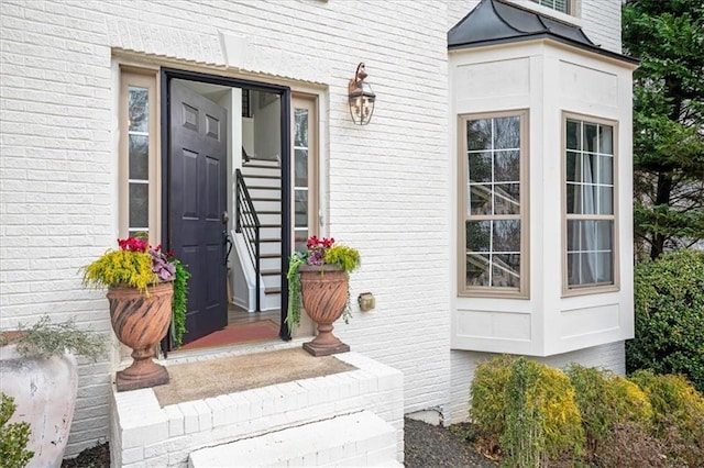 property entrance with brick siding