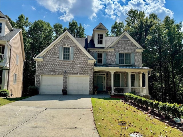 view of front facade with a front yard, a garage, and a porch