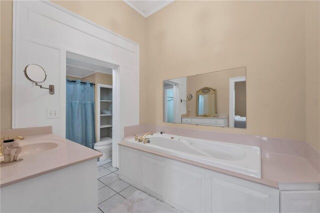 bathroom with a garden tub, toilet, vanity, ornamental molding, and tile patterned floors