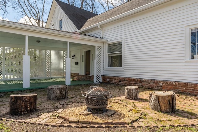 view of patio / terrace with an outdoor fire pit