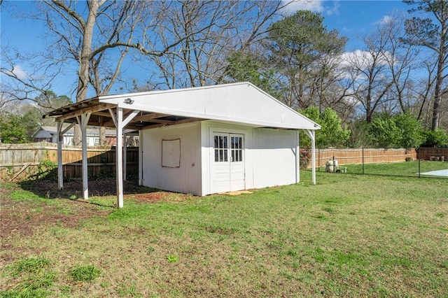 view of outdoor structure with an outbuilding and fence private yard