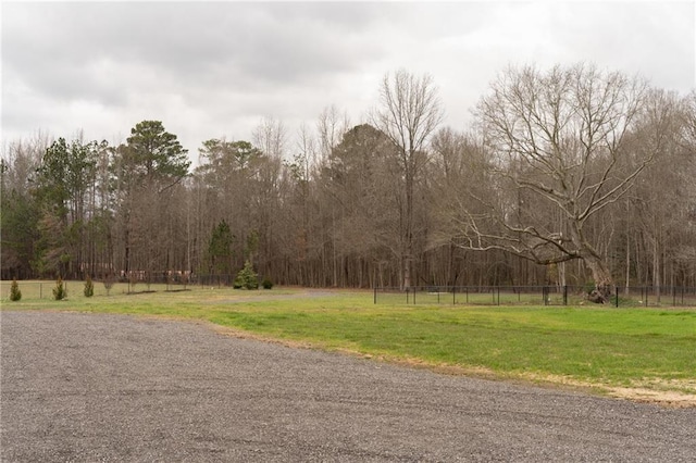 view of road with a wooded view