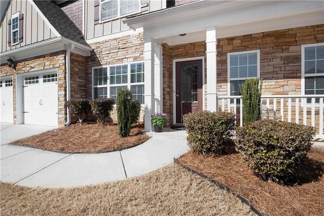 view of exterior entry with a garage