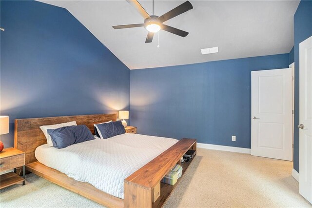 bedroom featuring lofted ceiling, ceiling fan, and light colored carpet