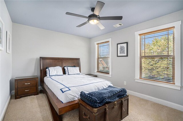 carpeted bedroom with ceiling fan