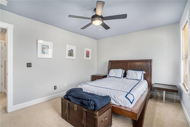 bedroom featuring ceiling fan and light colored carpet