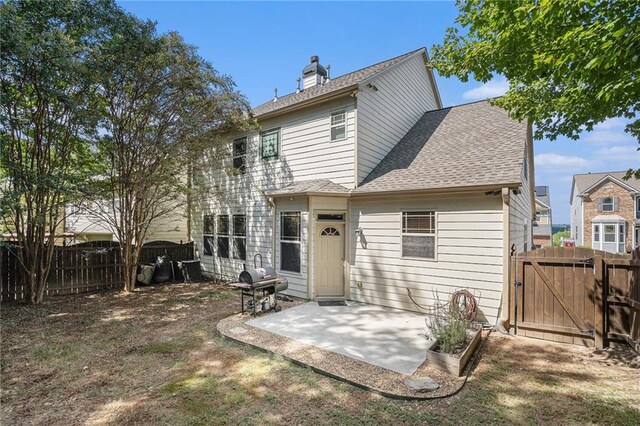 back of house with a patio area