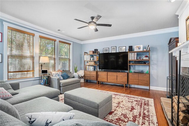 living room featuring crown molding, ceiling fan, and wood-type flooring