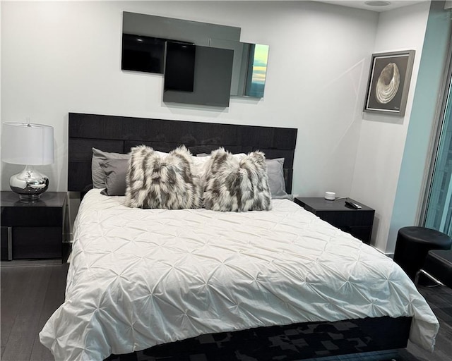 bedroom featuring wood finished floors