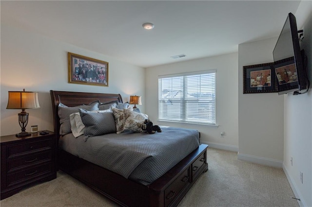 bedroom with light carpet