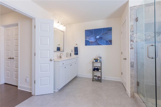 bathroom featuring vanity, walk in shower, and tile patterned floors