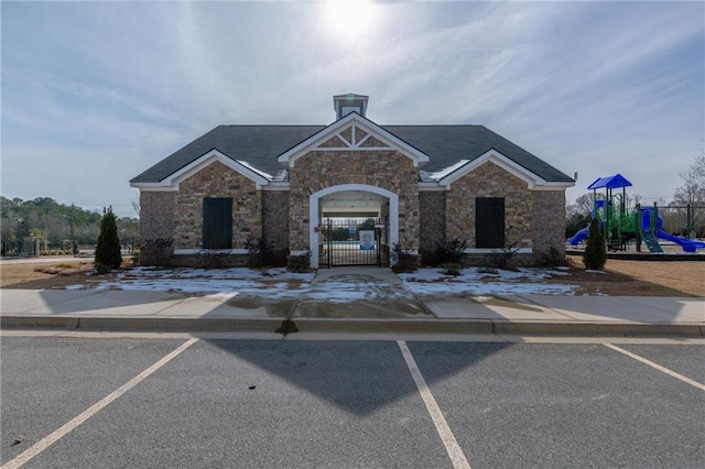 view of front of property featuring a playground