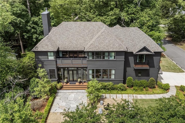 320 Shady Grove Ln, Alpharetta, GA 30009 - back of house with a balcony, a chimney, a shingled roof, and a deck