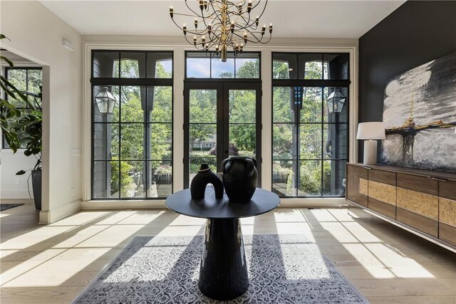320 Shady Grove Ln, Alpharetta, GA 30009 - entryway featuring a chandelier and baseboards