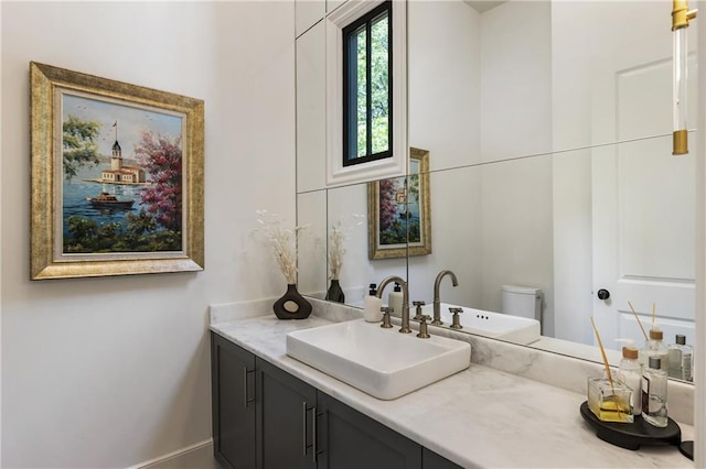 320 Shady Grove Ln, Alpharetta, GA 30009 - bathroom featuring vanity, toilet, and baseboards