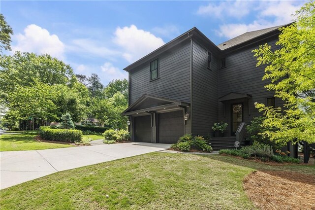 320 Shady Grove Ln, Alpharetta, GA 30009 - view of front of home with a garage, driveway, and a front yard