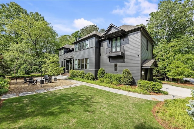320 Shady Grove Ln, Alpharetta, GA 30009 - rear view of house featuring a balcony and a lawn