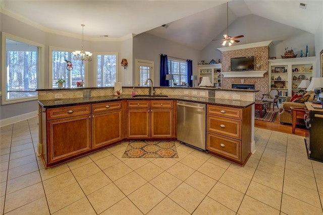 kitchen with stainless steel dishwasher, a sink, open floor plan, brown cabinets, and ceiling fan