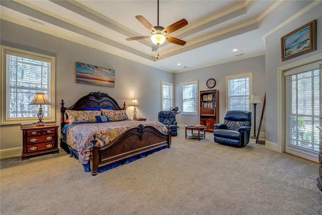 bedroom with a raised ceiling, crown molding, carpet floors, baseboards, and recessed lighting