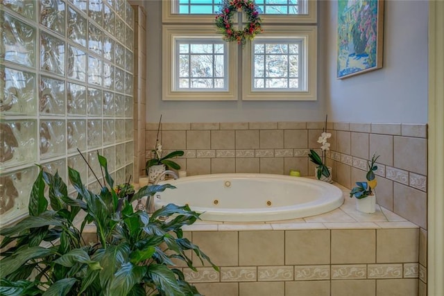 full bathroom featuring a tub with jets