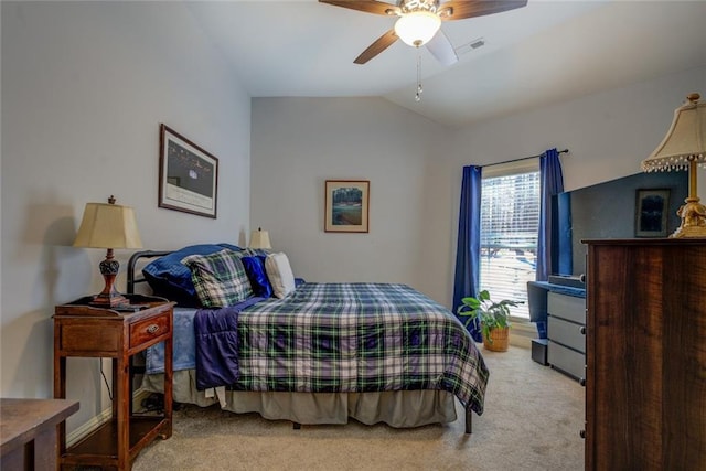 carpeted bedroom featuring vaulted ceiling and ceiling fan