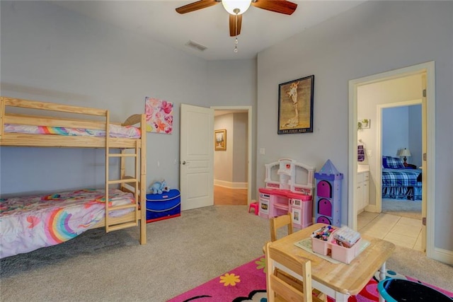 carpeted bedroom with baseboards and ceiling fan