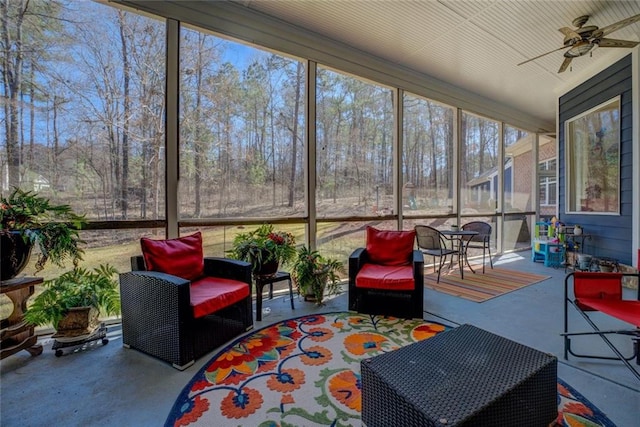 sunroom / solarium with ceiling fan