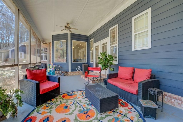 sunroom with outdoor lounge area and ceiling fan