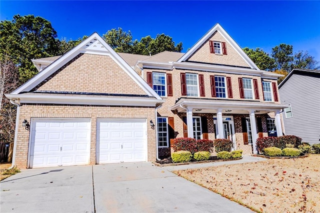 view of front of home with a porch and a garage