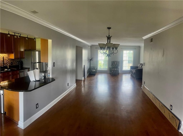 750 Dalrymple Rd Unit G3, Atlanta, GA 30328 - unfurnished dining area featuring a chandelier, baseboards, dark wood-type flooring, and crown molding