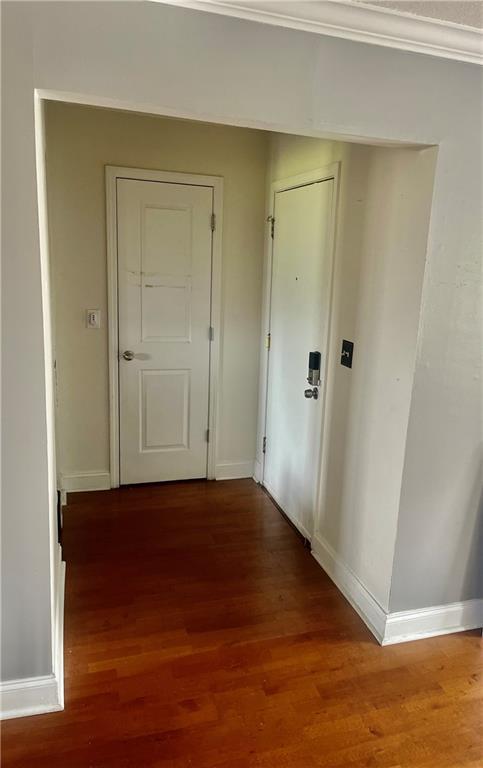 750 Dalrymple Rd Unit G3, Atlanta, GA 30328 - hall with baseboards, wood finished floors, and ornamental molding