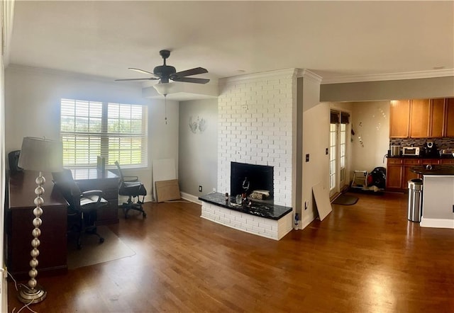 750 Dalrymple Rd Unit G3, Atlanta, GA 30328 - living area with ornamental molding, dark wood-type flooring, a fireplace, a ceiling fan, and a desk
