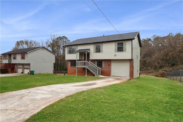 split foyer home with a front lawn and a garage