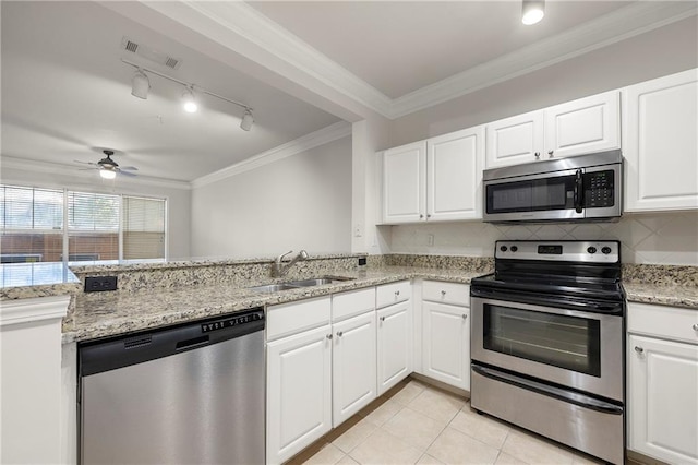 kitchen featuring sink, crown molding, appliances with stainless steel finishes, kitchen peninsula, and white cabinets