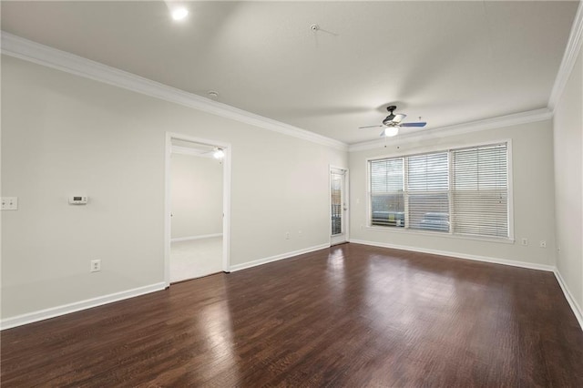 spare room with crown molding, ceiling fan, and dark hardwood / wood-style floors