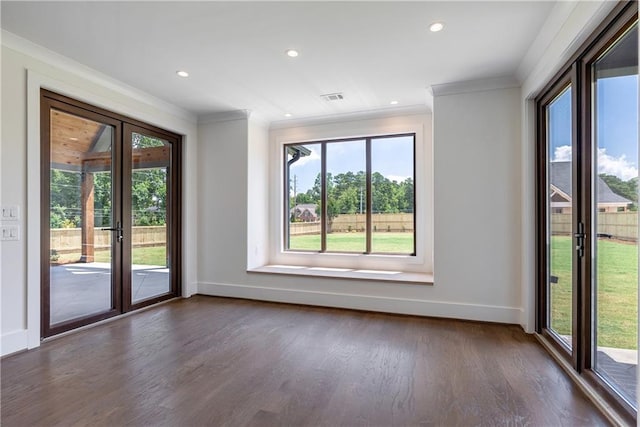 spare room with french doors, dark hardwood / wood-style flooring, and crown molding