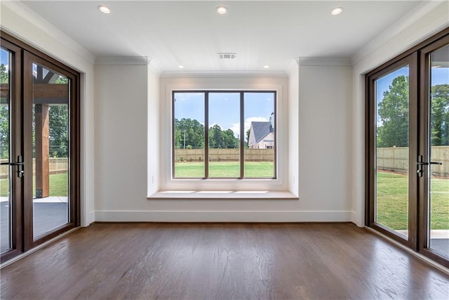 interior space featuring dark wood-type flooring and ornamental molding