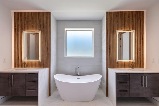 bathroom with a tub to relax in and vanity