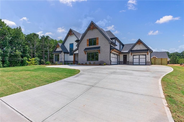 view of front of property with a front yard and a garage