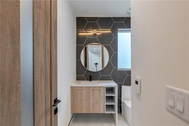 bathroom with vanity and toilet