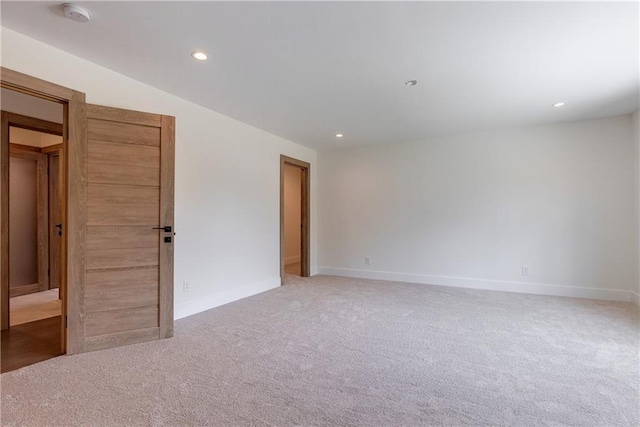 spare room with light colored carpet