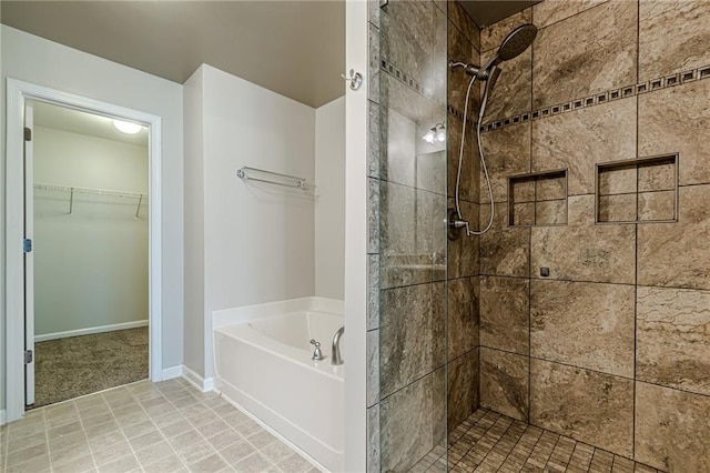 bathroom featuring separate shower and tub