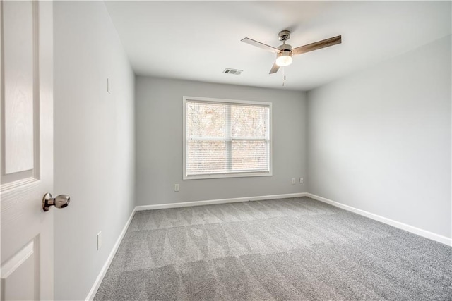 unfurnished room featuring ceiling fan and light colored carpet